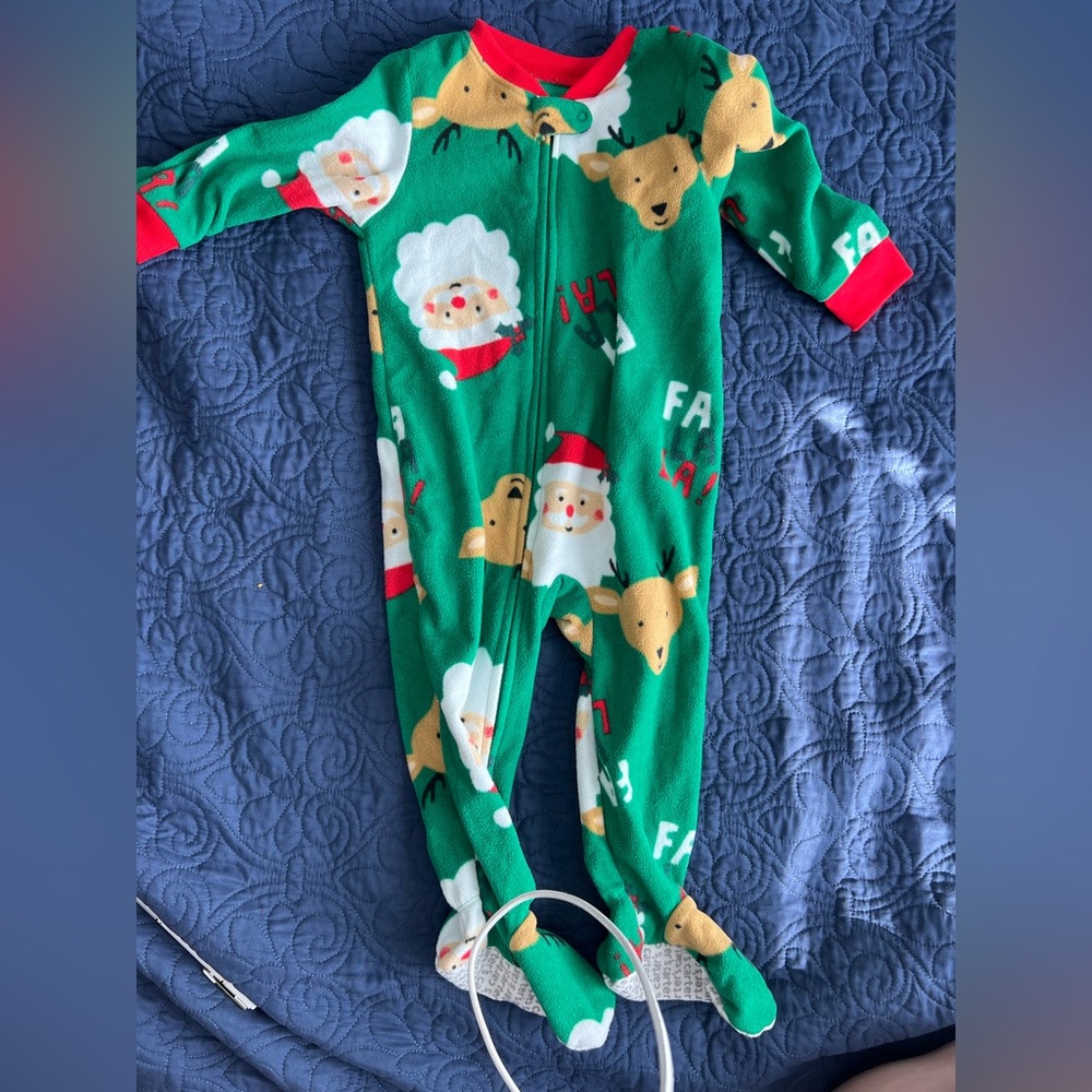 Size 18 months carters Christmas footy pajamas.  Santa and reindeers.